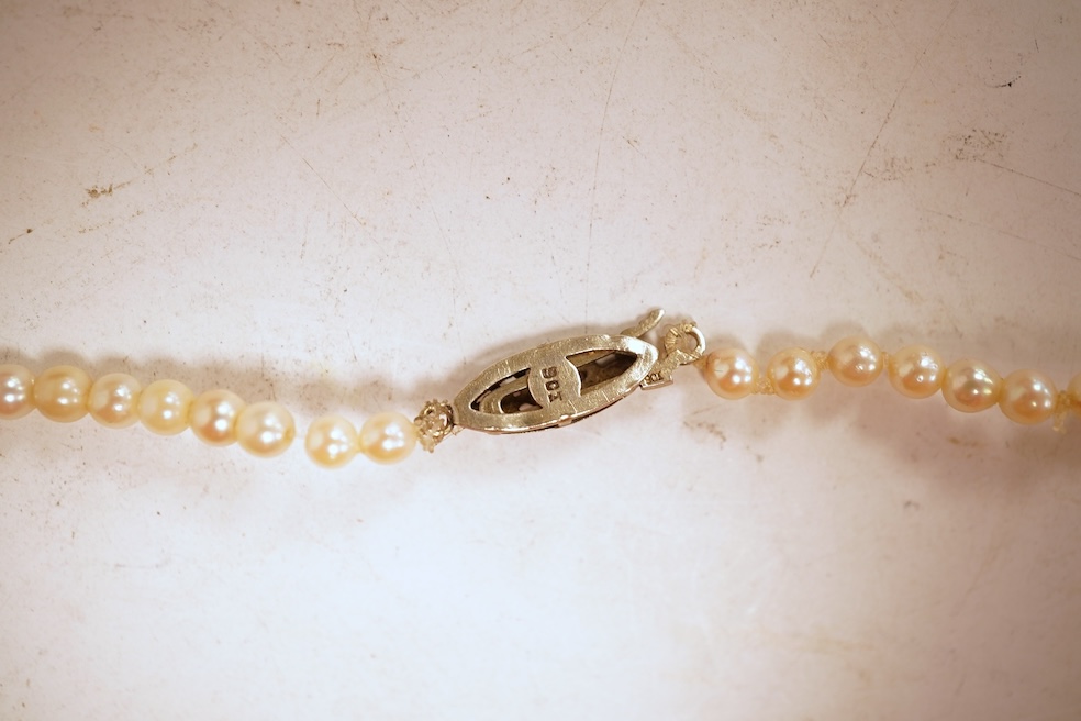 An eight-strand seed pearl choker necklace, with a rose-cut diamond clasp, length 34cm, pearls untested; together with a single strand graduated cultured pearl necklace, length 40cm, clasp stamped 9ct, Condition: good, s